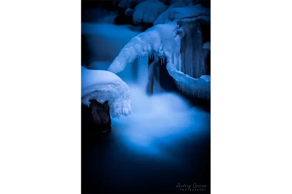 Cramer Imaging's nature photograph of a silky waterfall in the snow during winter in Idaho Falls, Idaho