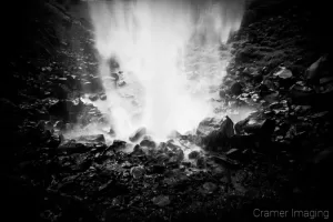 Cramer Imaging's black and white or monochromatic fine art landscape photograph of the backside of a waterfall in Twin Falls Idaho