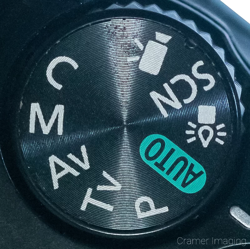 Audrey Cramer Photography's close-up photograph of a Canon DSLR camera settings dial