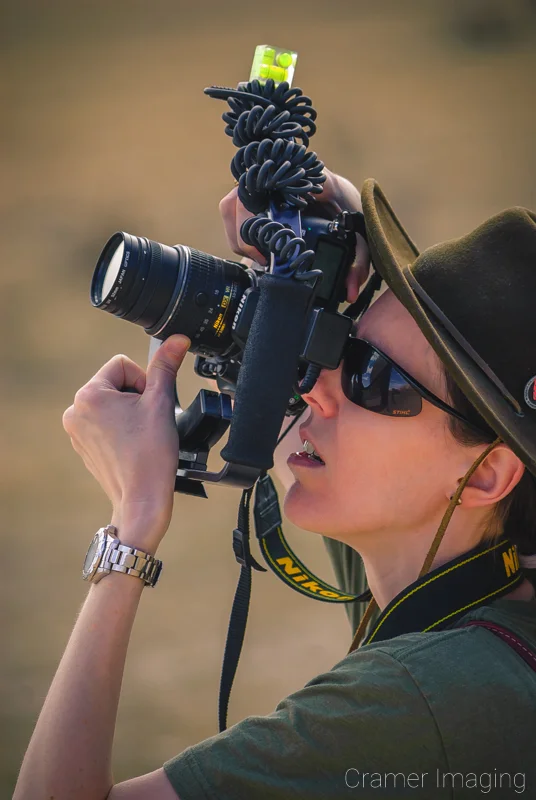 Photo of landscape photographer Audrey Cramer shooting up at subject matter