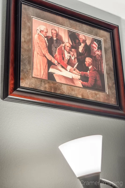 Audrey Cramer Photography's photograph example of fine art hung on the wall and illuminated by a nearby light source