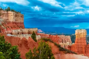 Fine art landscape photograph of Agua Canyon of Bryce Canyon National Park Utah with dark strormy clouds by Cramer Imaging