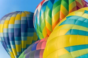 Cramer Imaging's fine art photograph of four hot air balloons clustered very close together