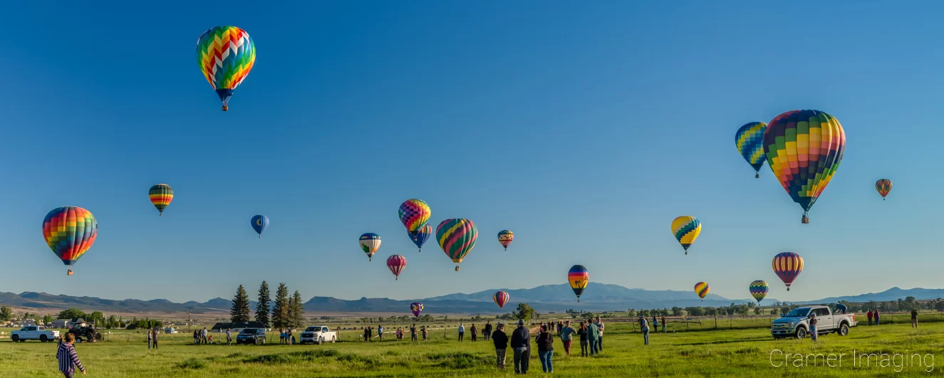 Cramer Imaging's fine art landscape panorama photograph of several hot air balloons in flight over Panguitch Utah