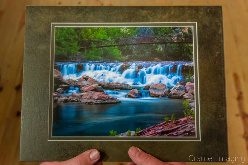 Audrey Cramer Photography's photograph of a man holding a matted copy of "Untouched" as a memory