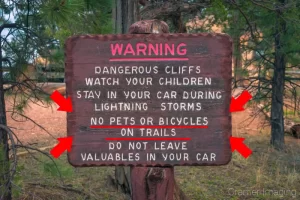 Cramer Imaging's photograph of a warning sign emphasizing a warning about no bikes and pets on trails