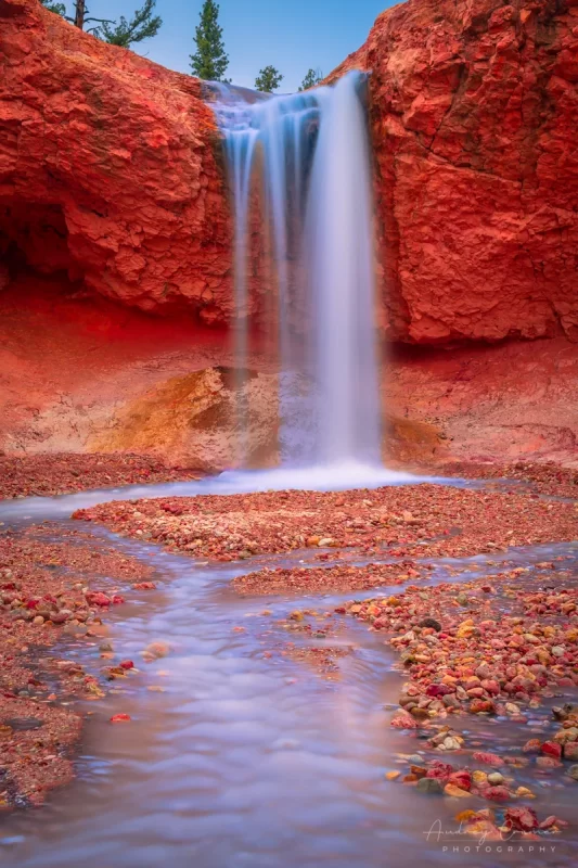 Audrey Cramer Photography's fine art landscape photograph of the Tropic ditch waterfall with silky water in Bryce Canyon National Park Utah