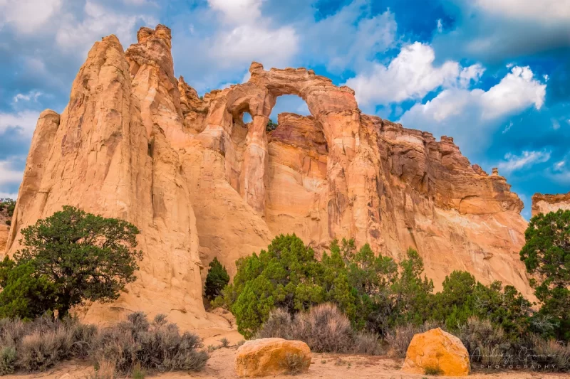 Fine art landscape photograph of the Grosvenor double arch with dramatic sky of Escalante National Monument Utah by Audrey Cramer Photography