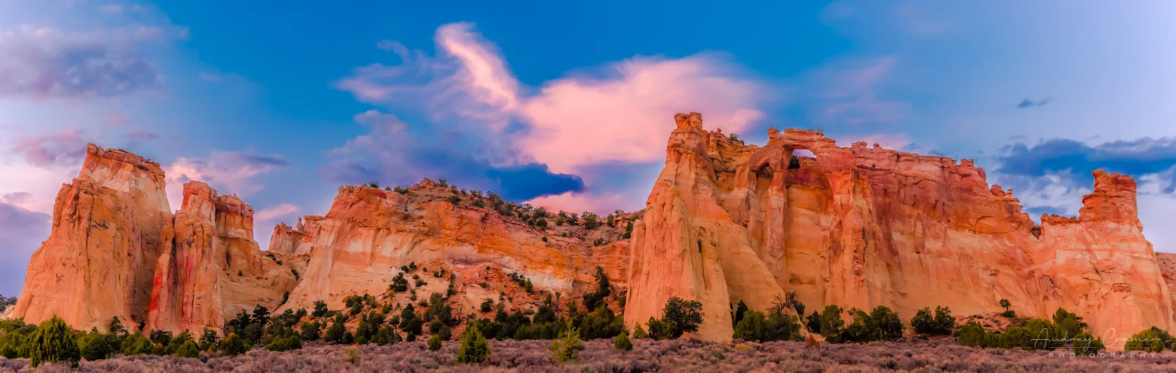 Cramer Imaging's fine art lanscape panorama photograph of the Kaiparowiets plateau featuring Grosvenor Arch in Escalante National Monument Utah at sunset