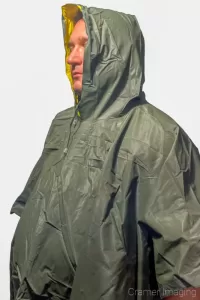 Cramer Imaging's photograph of a man wearing a green poncho against a white background