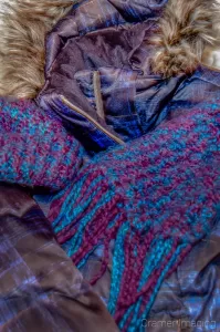 Cramer Imaging's photograph of a winter jacket or coat, a knitted scarf, and a matching knitted hat