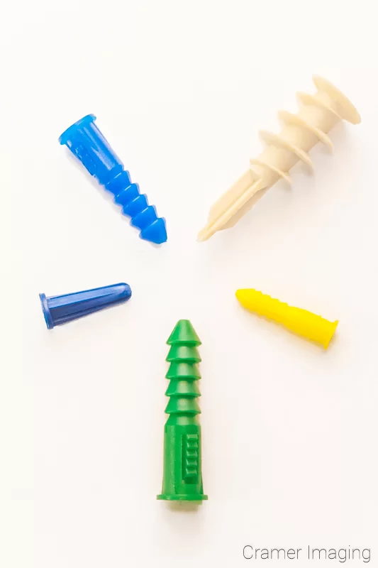 Audrey Cramer Photography's stock photo of 5 different kinds and colors of mollies for drywall hanging