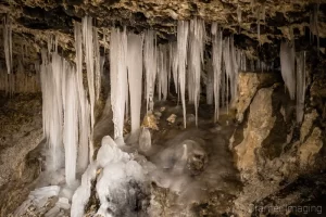 Cramer Imaging's fine art nature photograph of icicles hanging down as stalagmites in a cave