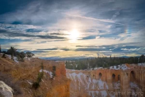 Cramer Imaging's fine art landscape photograph of a dramatic sky and sun dog or parhelion over Bryce Canyon National Park Utah