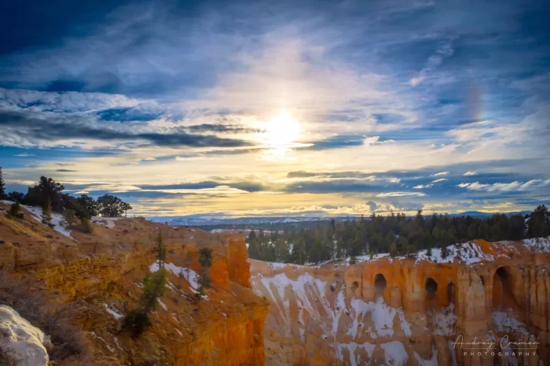 Audrey Cramer Photography's fine art landscape photograph of a dramatic sky and sun dog or parhelion over Bryce Canyon National Park Utah