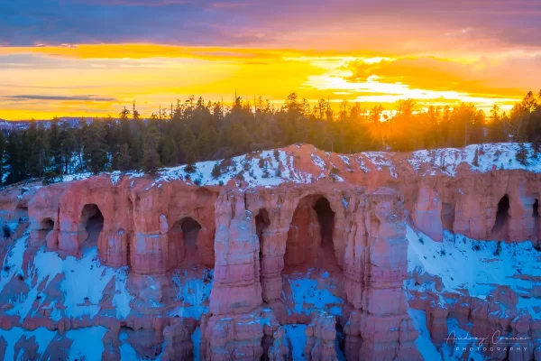 Audrey Cramer Photography's fine art landscape photograph of a winter sunburst sunset at Bryce Canyon National Park Utah