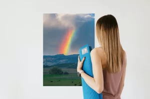 Photograph of Cramer Imaging's fine art photograph 'Idyllic' on the wall with a woman staring at it