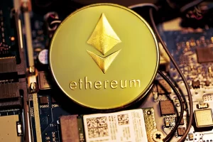 Photograph of a token representing Ethereum the cryptocurrency on a computer motherboard