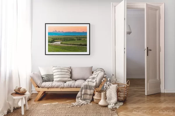 Photograph of Cramer Imaging's landscape photo "Moonrise Over the Tetons" in a cozy neutral-toned living room