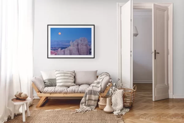 Photograph of Cramer Imaging's landscape photo "Red Moon Rising" in a cozy neutral-toned living room