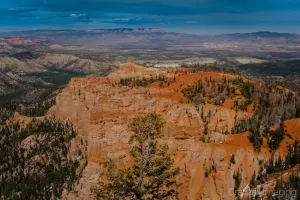 Photograph of Bryce Canyon's Rainbow Point under partly cloudy skies in Utah