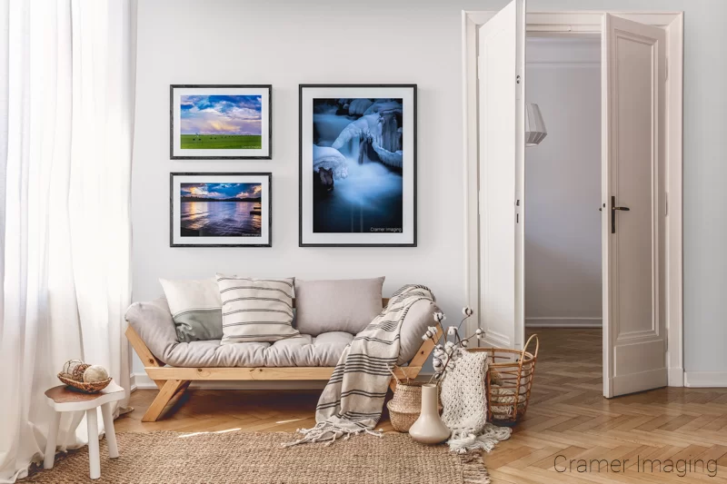 Photograph of 3 Audrey Cramer Photography landscape pictures displayed on a gallery wall according to subject matter theme