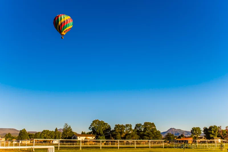 Landscape photograph with a hot air balloon featuring too much negative space