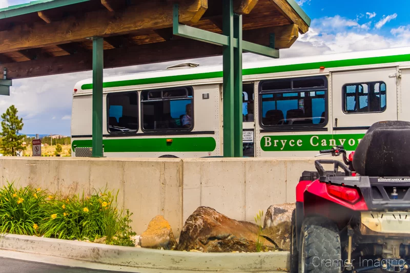 Photograph of a Bryce Canyon Shuttle bus leaving a shuttle stop in Bryce Canyon City Utah