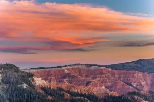 Cramer Imaging's fine art landscape photograph of fiery orange sunset clouds glowing over Cedar Breaks National Monument Utah