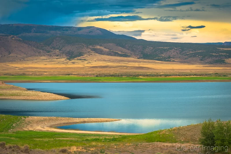 Cramer Imaging's fine art landscape photograph of a very low reservoir at Otter Creek State Park Utah at sunset