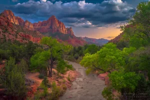 Cramer Imaging's fine art landscape photograph of a moody summer evening view of the Virgin River and Watchmen peak at Zion National Park Utah