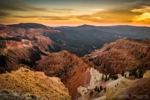 Cramer Imaging's fine art landscape photograph of a golden sunset warming the striking landscape of Cedar Breaks National Monument Utah