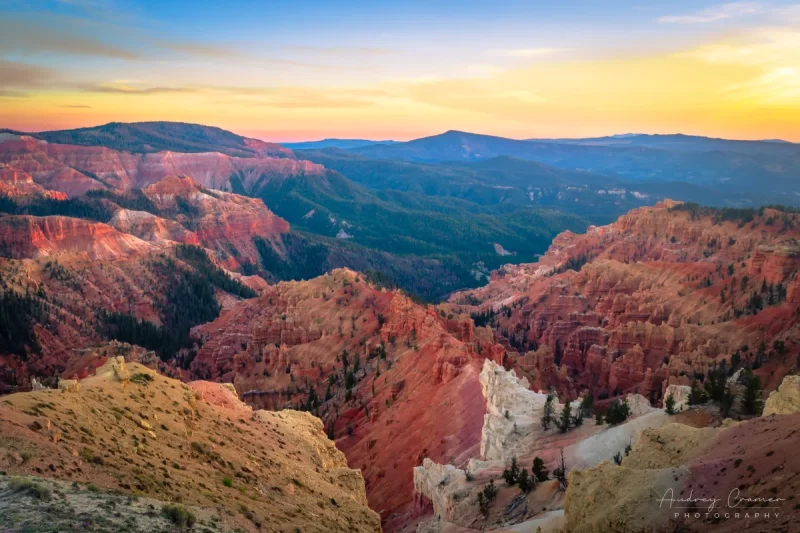 Audrey Cramer Photography's fine art landscape photograph of a golden sunset warming the striking landscape of Cedar Breaks National Monument Utah