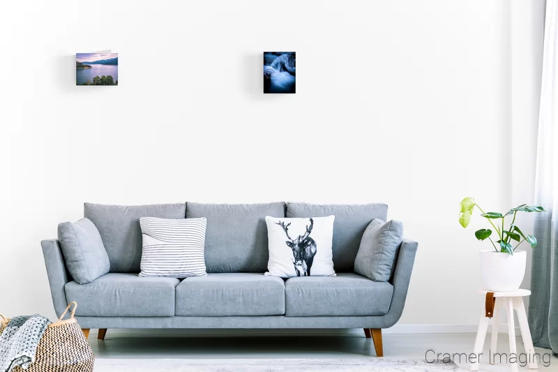 Image of a couple 8.5x11 landscape photo prints on the wall of a lounge