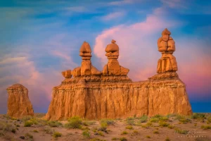 Cramer Imaging's fine art landscape photograph of the orange hoodoo rock formation called Three Sisters at sunset at Goblin Valley State Park Utah