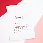 Calendar of the month of January with 4 dates circled on a colored background