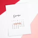 Calendar of the month of November with 4 dates circled on a colored background