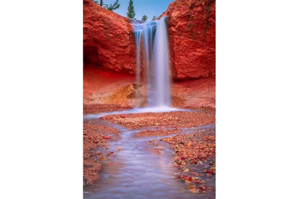 Audrey Cramer Photography's fine art landscape photograph of the Tropic ditch waterfall with silky water in Bryce Canyon National Park Utah