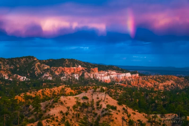 Audrey Cramer Photography's fine art landscape photograph of a rainbow above the lookout at Bryce Canyon National Park Utah