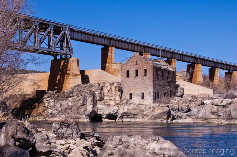 landscape photograph of the old abandoned powerhouse at the dam in American Falls, Power, Idaho by Audrey Cramer Photography