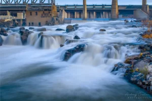 Cramer Imaging's fine art landscape photo of the American Falls reservoir spillway and Snake River full of silky smooth water