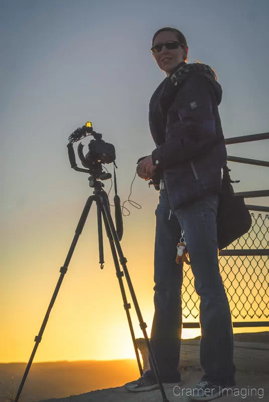 Audrey silhouetted against the rising sun by Audrey Cramer Photography