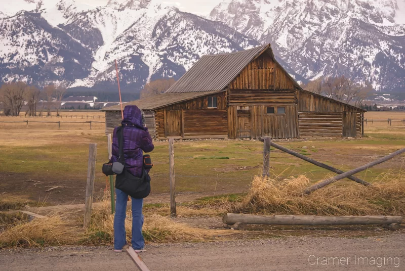 Audrey Cramer Photography's photograph of landscape photographer Audrey Cramer taking a Moulton Barn picture at Grand Teton National Park Wyoming