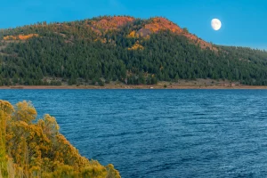 Cramer Imaging's fine art landscape photograph of the moon rising over Panguitch Lake Utah in Autumn