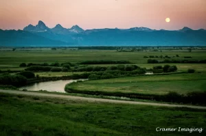 Cramer Imaging's professional quality landscape photograph of the Teton mountains and river at moon rising in Tetonia, Teton, Idaho