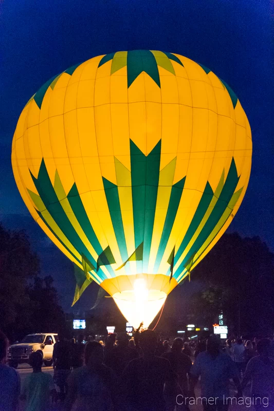 Cramer Imaging's fine art photograph of a hot air balloon glow at night in the streets of Panguitch Utah