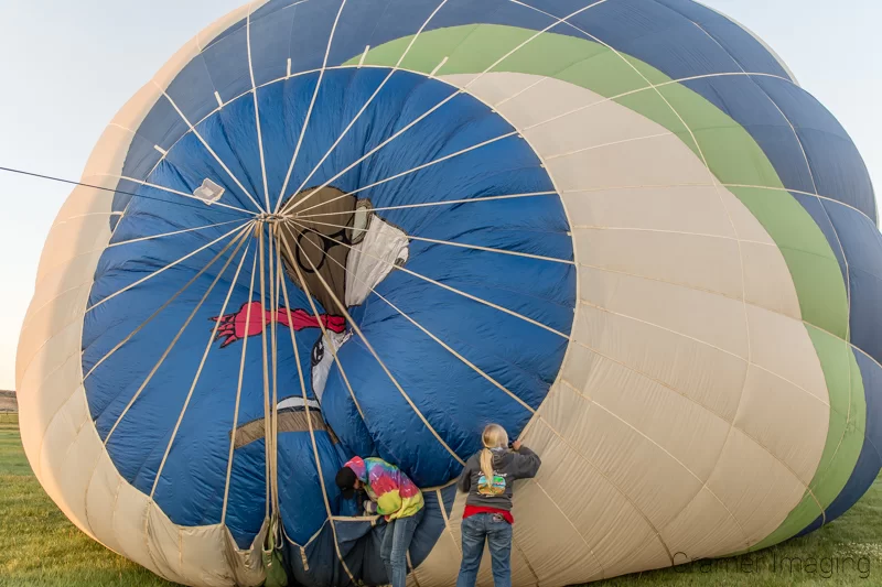 Audrey Cramer Photography's fine art photograph of a hot air balloon being inflated with Snoopy on the top