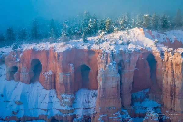 Audrey Cramer Photography's fine art landscape photograph of dawn rising over magical fog the landscape of Bryce Canyon National Park, Utah