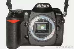 Cramer Imaging's photo of a Nikon D200 camera showing the sensor on a white background