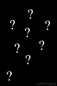 Graphic of question marks representing confusion on a black background by Cramer Imaging